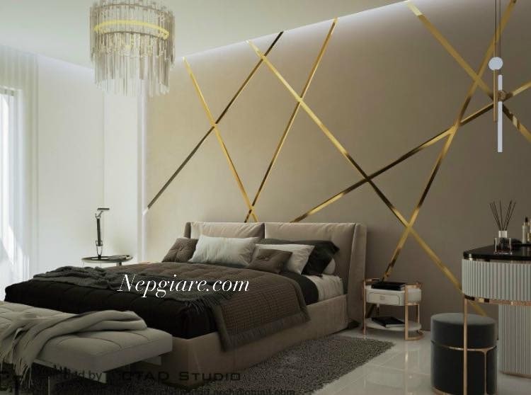 Nẹp inox chữ U mạ vàng đồng được gắn lên tường phòng ngủ để tạo ra các hình dạng độc đáo